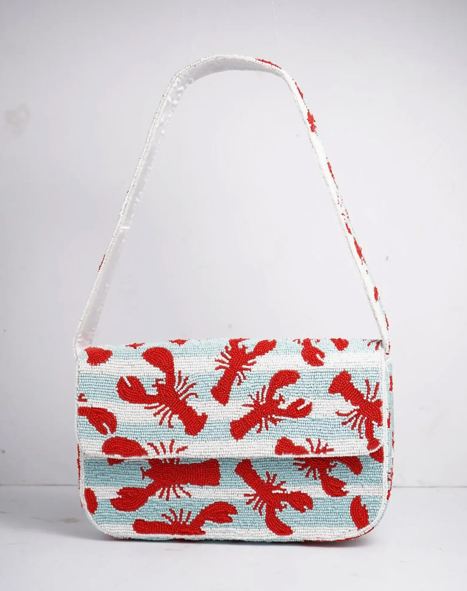 Lobster beaded shoulder bag with detailed red lobster design and structured silhouette