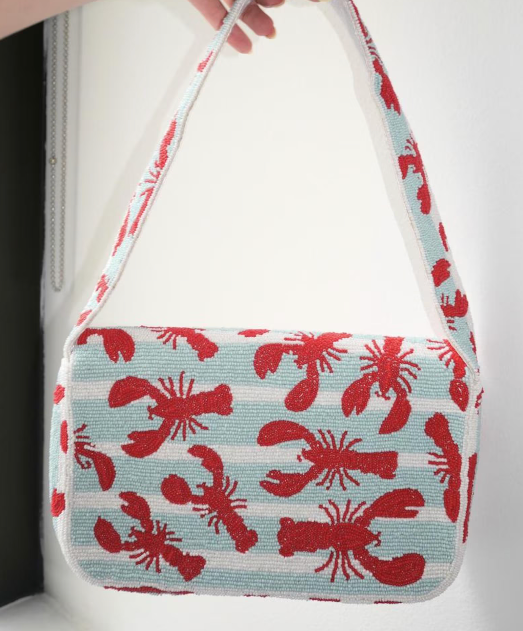 Lobster beaded shoulder bag with detailed red lobster design and structured silhouette